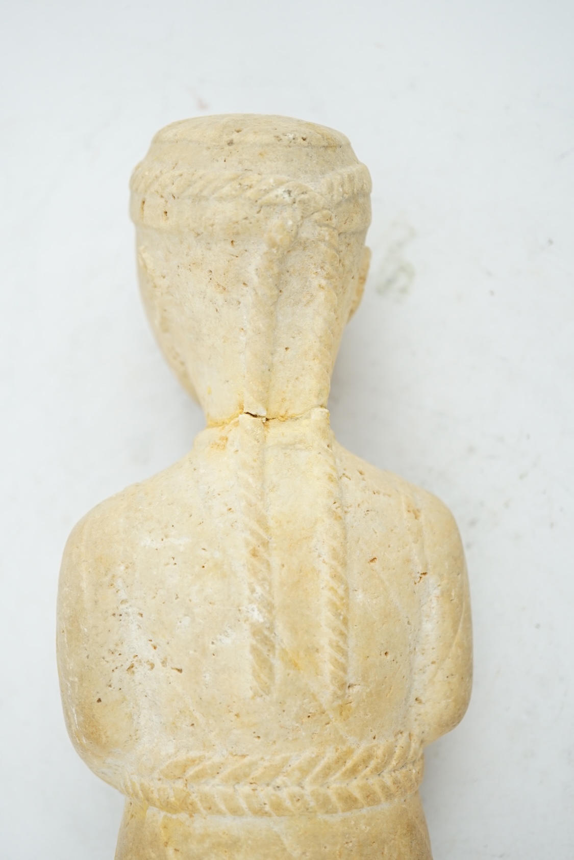 An unusual limestone votive figure, with cuneiform inscription, possibly Mesopotamian